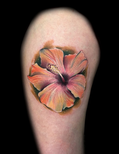 Orange and pink realistic colored hibiscus tattoo.